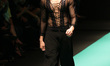 A model presents a creation of Jun Jun Cambe during the Philippine Fashion Week held at th...