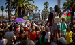 People gather during the farewell to the Global Sunat Flotilla at the Port of Barcelona on...