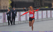 Lizaida Valdivia from Peru celebrates after crossing the finish line in second place in th...