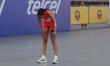 Bekelech Gudeta Borecha from Ethiopia vomits after crossing the finish line in second plac...