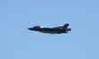 The Lockheed Martin F-35 Lightning II performs a vertical climb, displaying its fifth-gene...