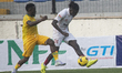 Joseph Arumola of Ikorodu City dribbles past Bilal Yakubu of El-Kanemi Warriors as Ikorodu...