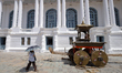 A tourist walks past the chariots built in front of the Gaddhi Baithak in the premises of...
