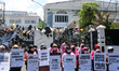 A number of people hold a demonstration by throwing garbage in front of the West Java Regi...