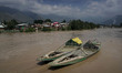 The overflowing River Jehlum enters the residential areas in Zoonipora on the outskirts of...