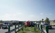 People put up tents on a highway after being rescued from a submerged neighborhood when th...