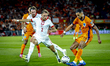 Poland defender Matty Cash and Netherlands forward Cody Gakpo play during the match betwee...