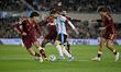 Lionel Messi of Argentina fights for the ball against players from Venezuela during a Sout...