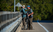 Birders look for birds at the Great Miami River in North Bend, Ohio, on September 8, 2025....