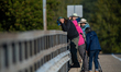 Birders look for birds at the Great Miami River in North Bend, Ohio, on September 8, 2025....