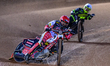 Dan Bewley of Belle Vue Aces in red leads Tom Brennan of Ipswich Witches in white during t...
