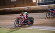 Brady Kurtz of Belle Vue Aces in red rides inside Jason Doyle of Ipswich Witches in white...