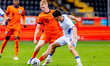 Netherlands player Kees Smit (L) duels with Israel player Ran Binyamin (R) during the matc...