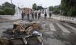 Nepal Army personnel stand guard in front of the vandalized Presidential residence in Kath...