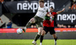 PSV Eindhoven midfielder Jerdy Schouten and NEC forward Bryan Linssen play during the matc...