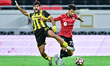 Tiago Rafael Da Silva of AL Rayyan and Said Mohamed Brahmi of Qatar SC are in action durin...