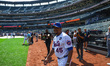 Former New York Mets player Pedro Martinez (45) comes onto the field during warmups before...