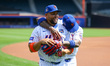 Former New York Mets players Jose Reyes (7) and Carlos Beltran (15) participate in warmups...