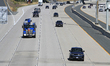 Vehicles drive along a section of Highway 407 in Mississauga, Ontario, on September 16, 20...