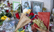 Flowers are placed at a makeshift memorial near the Elevador da Gloria following the deadl...