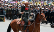 A charro on horseback takes part in the Civic-Military Parade, commemorating the 215th Ann...