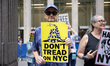 Members of the activist group Rise and Resist and supporters gather for a weekly protest o...