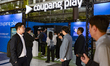 Visitors and buyers gather at the Coupang Play booth during the 25th Broadcast Worldwide (...