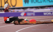 Lomi Muleta (ETH) is on the floor after the Women's 3000m Steeplechase Final during the Wo...