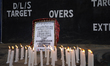 Members of the Nepali national cricket team (male) light candles in memory of those killed...