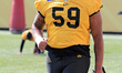 Hamilton Tiger-Cats player Quinton Barrow warms up during the Canadian Football League tea...