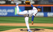 New York Mets starting pitcher Jonah Tong (21) throws during the fifth inning of a basebal...