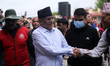 Former Nepali Prime Minister and Chairman of the CPN-Maoist Center, Pushpa Kamal Dahal, gr...