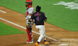 Francisco Alvarez of the New York Mets scores during the fourth inning of a baseball game...