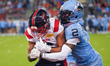 Wide receiver Tyson Philpot #6 of the Montreal Alouettes is pressured by defensive back Ta...