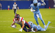 Wide receiver Tyson Philpot #6 of the Montreal Alouettes is tackled after the reception in...