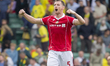 Dominic Hyam of Wrexham celebrates their win with supporters during the Sky Bet Championsh...