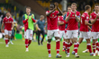 Issa Kabore of Wrexham celebrates their win with supporters during the Sky Bet Championshi...
