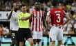Miguel Angel Ortiz shows a red card to Daniel Vivian of Athletic Club de Bilbao after a VA...