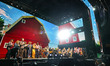 Artists gather on stage during the Farm Aid 40 Music Festival in Minneapolis, Minnesota, o...
