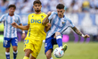 In Malaga, Spain, on September 21, 2025, Izan Merino of Malaga CF competes for the ball wi...