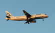 An SX-DVI Aegean Airlines Airbus A320-200 flies over the match venue during the YoHealth M...