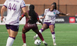 Tiffany Cameron #33 of Halifax Tides FC and Nikayla Small #4 of AFC Toronto battle for the...