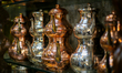 Traditional handmade copper and brass items are displayed at a local market in Gaziantep,...