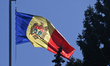 CHISINAU, MOLDOVA – SEPTEMBER 26, 2025A Moldovan flag flies in central Chisinau ahead of...