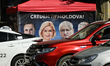 CHISINAU, MOLDOVA – SEPTEMBER 26, 2025Cars drive past a Patriotic Electoral Bloc (BEP) el...