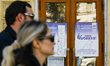 CHISINAU, MOLDOVA – SEPTEMBER 26, 2025People walk by a Election poster in Chisinau city c...