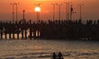 People enjoy the sunset at Kedonganan Beach in Badung, Bali, on September 26, 2025. Kedong...