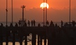 People enjoy the sunset at Kedonganan Beach in Badung, Bali, on September 26, 2025. Kedong...