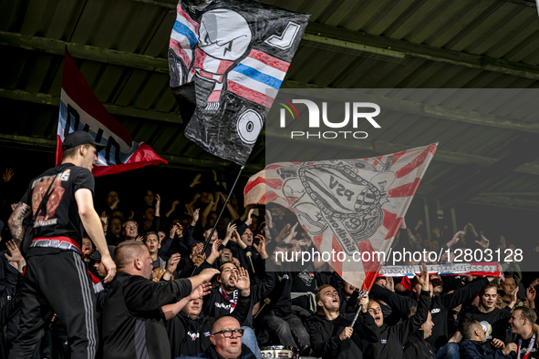 Supporters of PSV attend the match between Excelsior Rotterdam and PSV Eindhoven at Stadium Woudestein for the Dutch Vriendenloterij Eredivi... by EYE4images/NurPhoto