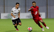 Eder of Hamrun Spartans is closely followed by Lyon Abela of Hibernians during the YoHealt...